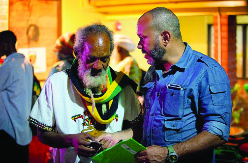 World Cannabis Cup organizer Ras Iyah V, left, confers as the event gets ready to roll.