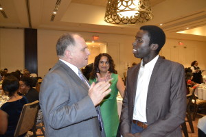 Lawyer Rocco Galati, left, and anti-carding activist Desmond Cole discuss the province’s plans to end carding across Ontario. Gerald V. Paul photo.