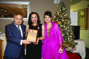 Dr. Rosemary Sadlier is flanked by Thomas Saras, National Ethnic Press and Media Council president, and Maria Saras-Voutsinas, executive director. By Gerald V. Paul