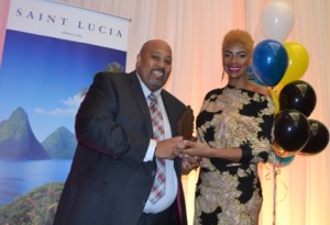 Young Professional Award winner Karlyn Percil-Mercieca receives her award from Ross Cadesse, president of Saint Lucia Toronto association