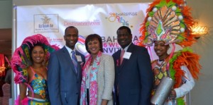 Flanked by two Junkanoo Carnival celebrants are Bahamas Ministry of Tourism’s Paul Strachan, director for Canada, Joy Jibrilu, director general and Stephen Johnson, senior manager of business development. Gerald V. Paul photo.
