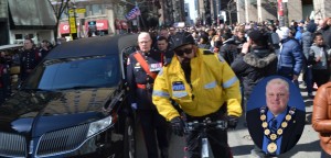 A hearse carrying former Toronto mayor Rob Ford’s body makes its way through throngs of supporters on its way to St. James Cathedral yesterday for the funeral service. Rob Ford (Insert)