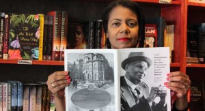 Kathy Grant, founder of the Legacy Voices Project, holds a photo of Donald Willard Moore.