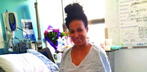 Elissa Antonio tentatively stands up as she recovers in Toronto from injuries during a trip to Trinidad.