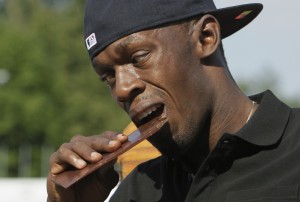 Champion runner Usain Bolt knoshes on chocolate.