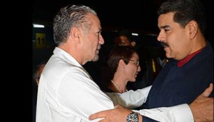 Venezuelan President Nicolas Maduro, right, greets Jamaica President of the Senate Tom Tavares Finson.