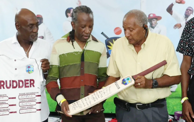 David Rudder gets a gift from Windies cricket legends